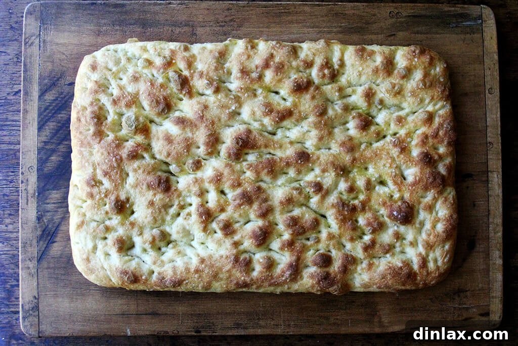 Ultimate Sheet Pan Breakfast Slab Sandwich: Bacon, Egg, and Cheese 10 A cutting board with baked focaccia.