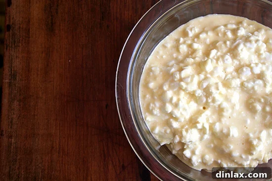 The creamy Tiropita filling mixture in a glass bowl, ready for assembly.