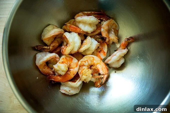 A bowl filled with perfectly grilled shrimp, still warm and slightly charred.