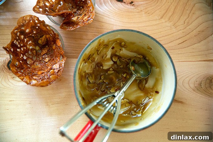 Refreshing Strawberry Sorbet Nestled in Buttery Almond Butterscotch Cookie Cups 14 Close-up of golden almond-butterscotch cookie cups, fresh from the oven, showing their delicate lacy edges.