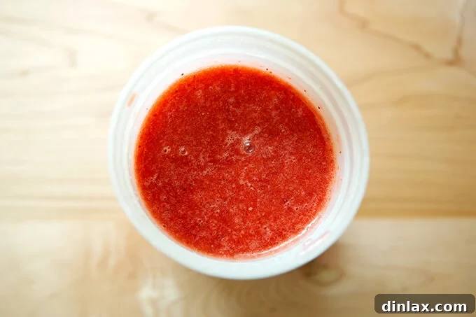 Refreshing Strawberry Sorbet Nestled in Buttery Almond Butterscotch Cookie Cups 9 Chilled strawberry puree in a clear storage container, ready for the ice cream maker.