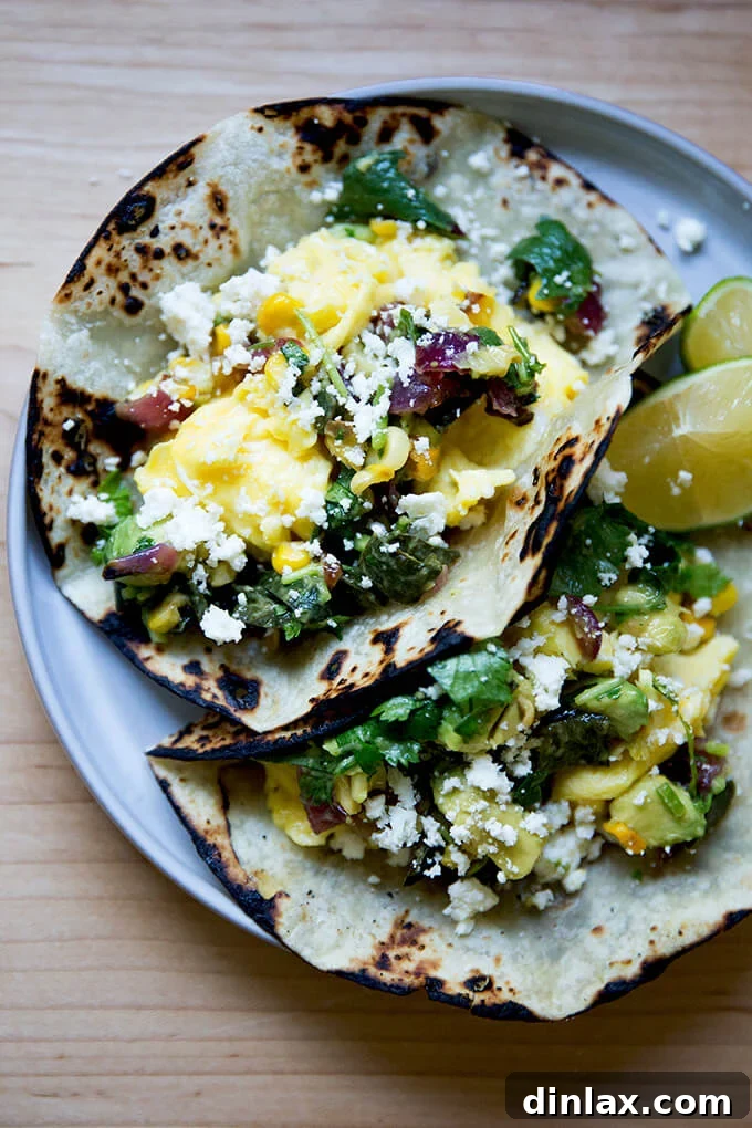 A close-up of a delectable breakfast taco generously adorned with queso fresco.