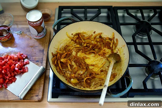 A board with sautéed onions and spices.