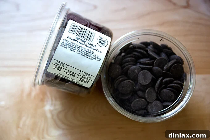 Decadent Gluten-Free Chocolate Chip Cookies 4 A tub of premium 64% cacao chocolate wafers, essential for superior gluten-free chocolate chip cookies.