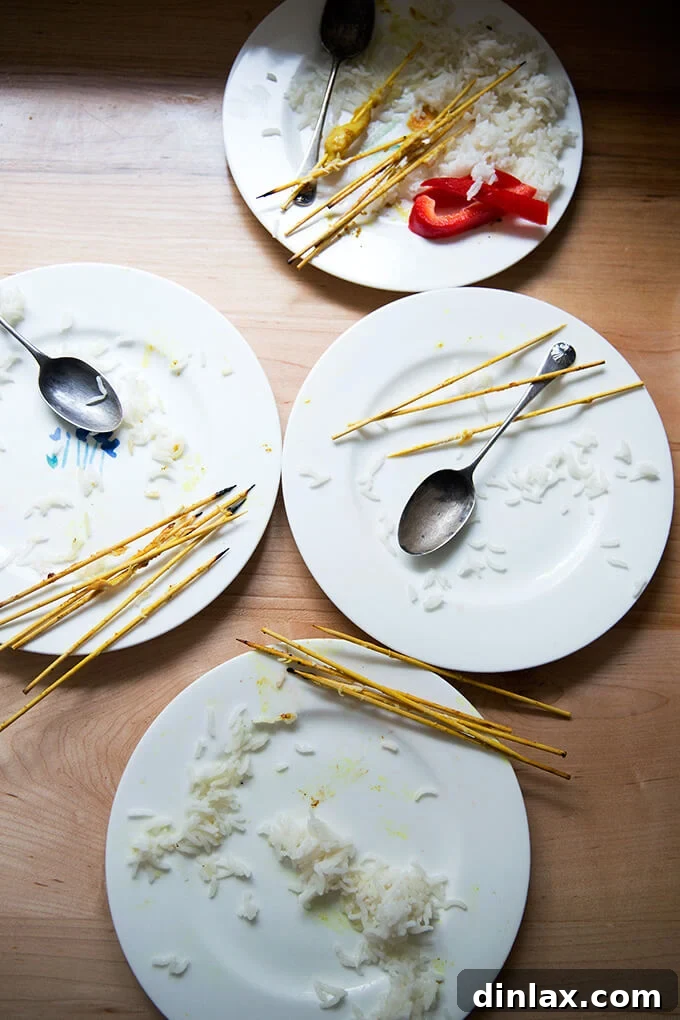 Four pristine, empty plates, remnants of a delicious meal of easy Thai chicken satay and coconut rice, clearly show that the dinner was a huge hit.