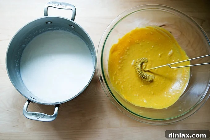 A pot of uncooked coconut rice, prepared with coconut milk and water, sits beside a bowl of vibrant easy Thai chicken satay marinade, showcasing the readiness of both main components for cooking.