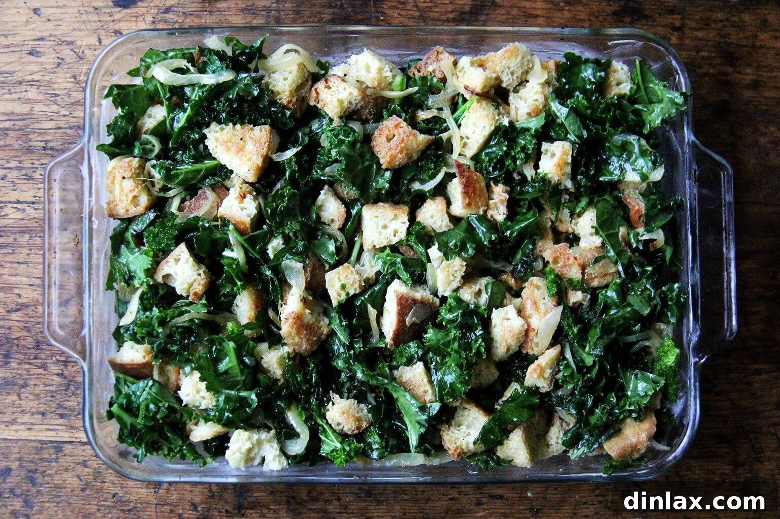 A 9x13-inch baking pan filled with the prepared, uncooked stuffing mixture, ready for baking or freezing.