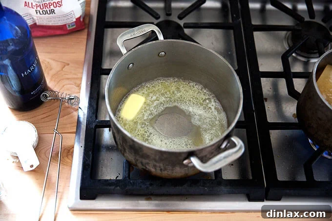 A saucepan filled with melted butter.