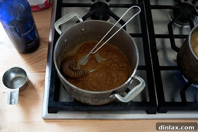 A saucepan filled with a roux and Sherry mixed together.