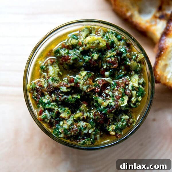 Sun-dried Tomato and Spinach Pesto with Crostini, a delightful blend of rich flavors perfect for any gathering.
