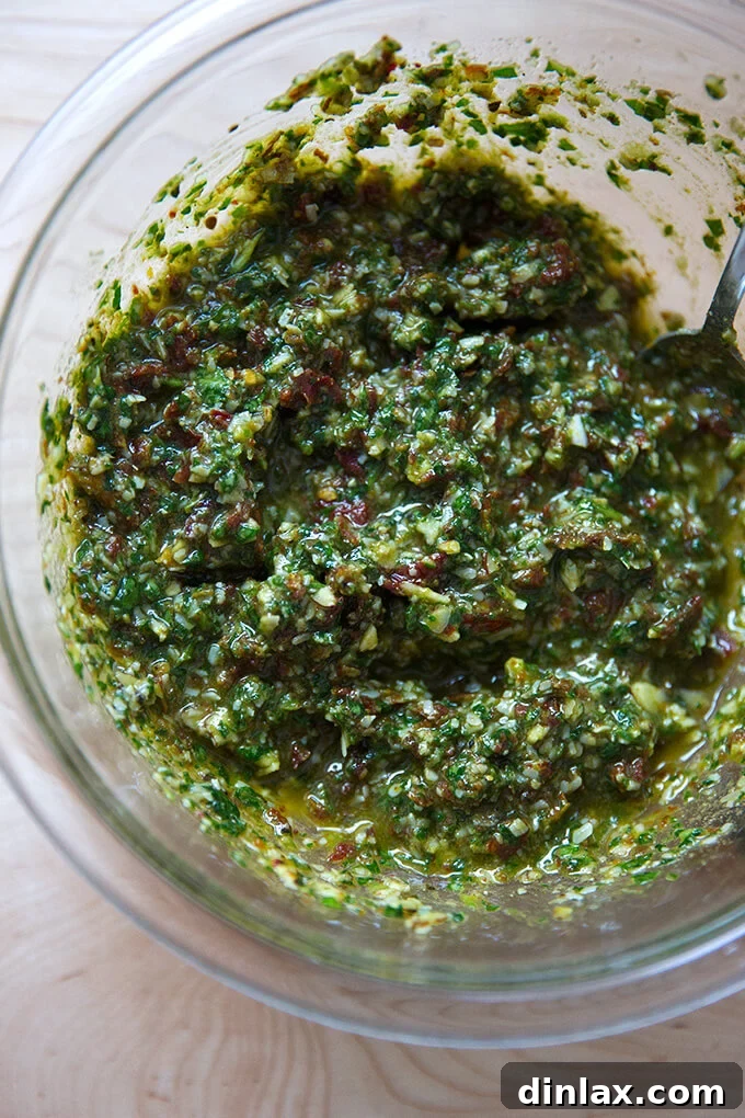 Sun-Kissed Tomato and Spinach Pesto Crostini 6 A beautiful bowl of freshly made sun-dried tomato and spinach pesto, vibrant and ready to serve.