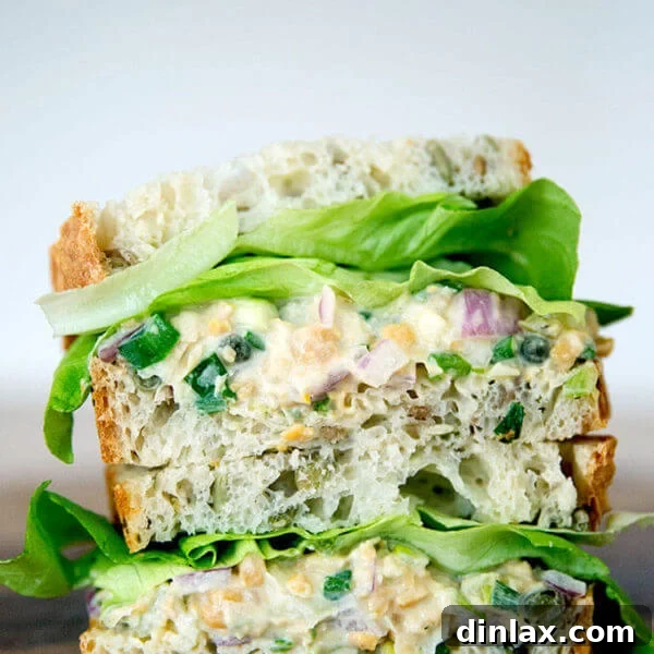 No-tuna "tuna" salad sandwich, cut and stacked on top of one another.