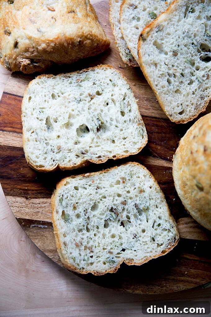 Sliced three-seed bread on a board.