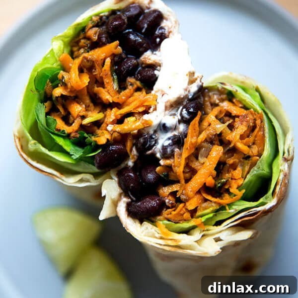 Overhead shot of halved sweet potato and black bean burrito.