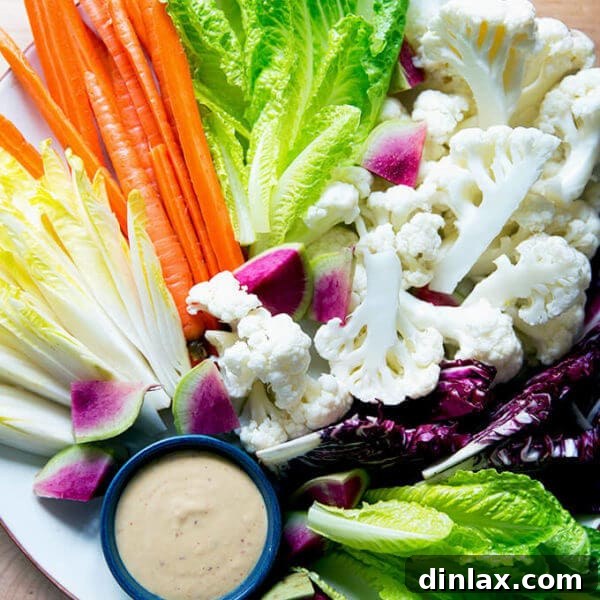 A platter of crudités with spicy cashew dip.