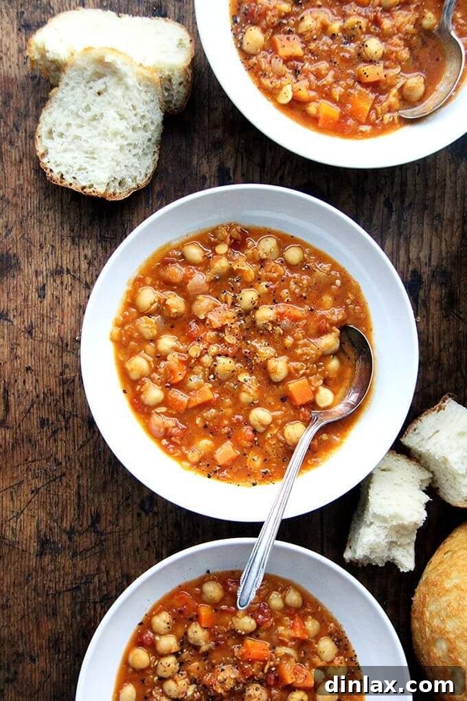 10 Essential Chickpea Recipes You Need Today 6 A hearty bowl of curried chickpea and lentil soup, rich with spices and vegetables, offering a comforting and nutritious meal.