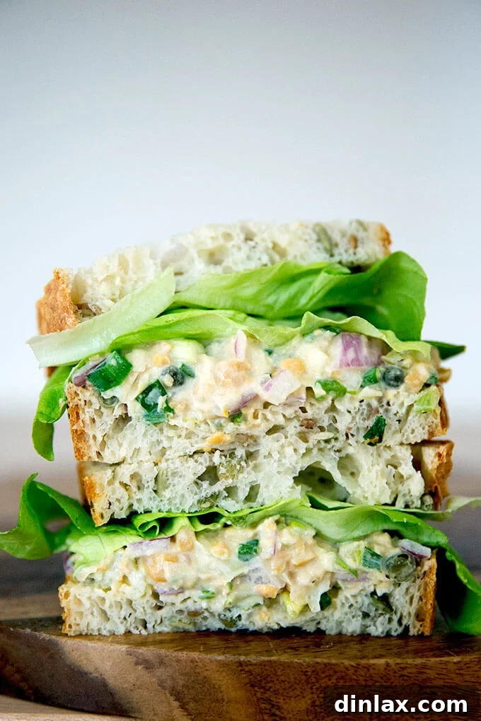 10 Essential Chickpea Recipes You Need Today 8 Delicious and satisfying no-tuna "tuna" salad sandwiches, perfectly cut and stacked, showcasing a healthy and flavorful plant-based alternative.