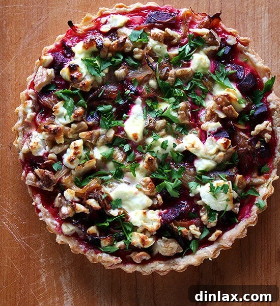 The finished Beet, Goat Cheese, and Walnut Tart, a savory masterpiece ready to be served.