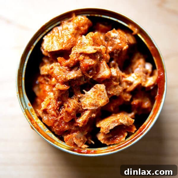 Korean double hot tuna mixed with Kewpie mayonnaise in its can, served with fresh lemon slices.