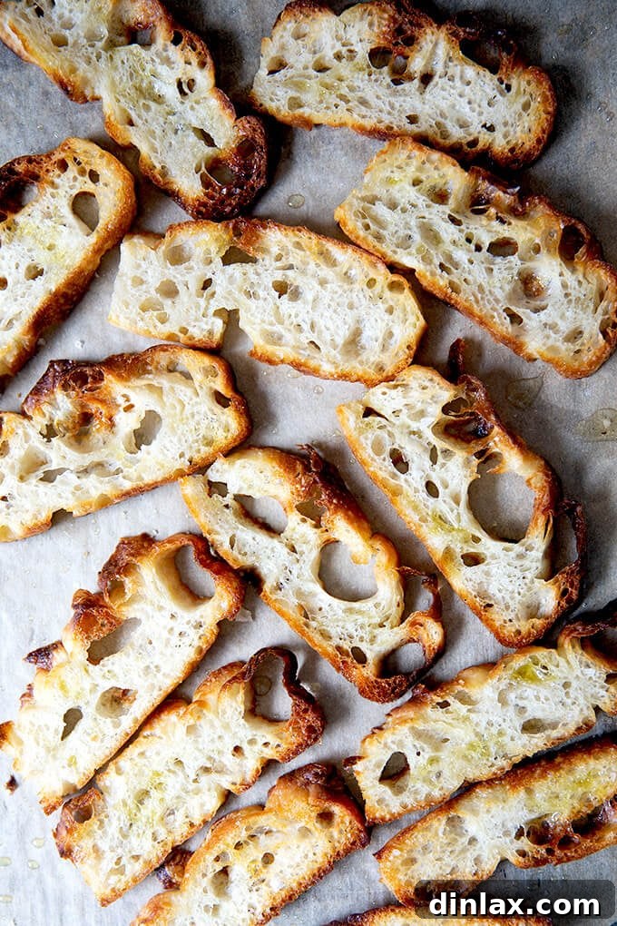 Korean Fire Tuna Crostini 9 Freshly baked, golden-brown focaccia crostini cooling on a sheet pan, ready to be served with appetizers.