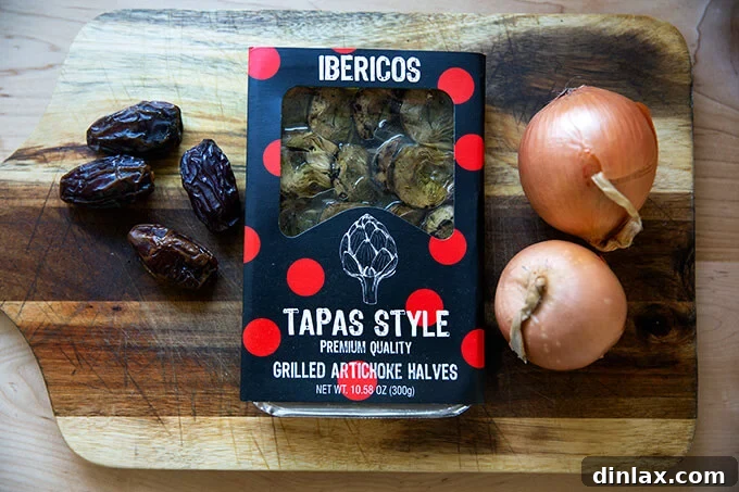 A selection of fresh ingredients including dates, artichoke hearts, and onions, ready for meal preparation.