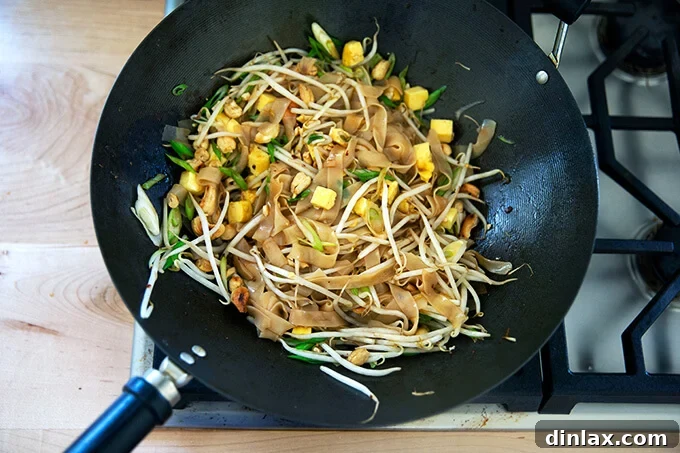 Continental's Signature Rad Na Noodles 7 Rad na Thai in a wok.