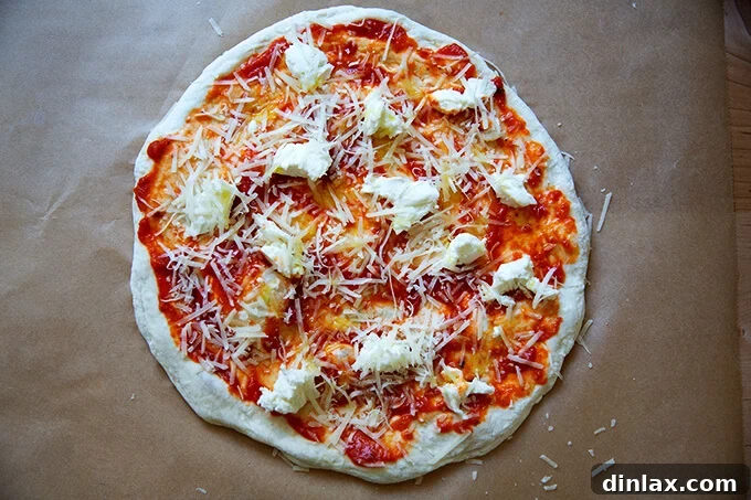 Unlock the Best Sourdough Pizza Crust 14 Stretched and topped sourdough pizza round.