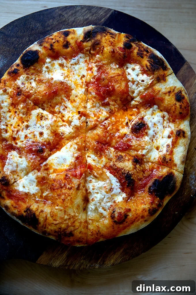 Unlock the Best Sourdough Pizza Crust 16 Just baked sourdough pizza crust cut into slices.