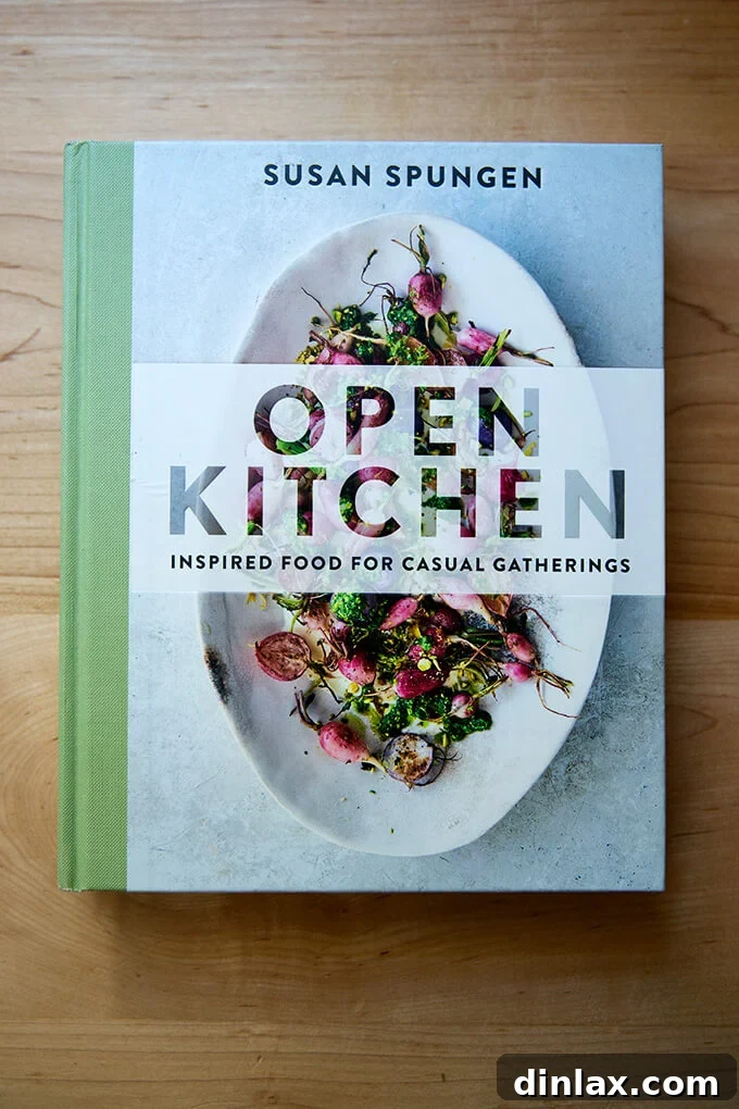 A stunning cover image of Susan Spungen's cookbook, 'Open Kitchen', prominently displayed to entice readers.
