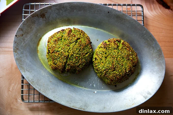 Freshly broiled falafel burgers, golden and crispy, hot off the pan and ready to be enjoyed.
