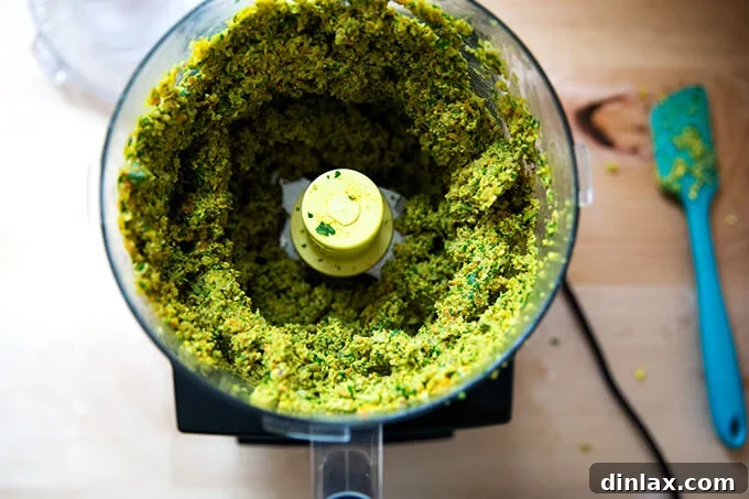 The falafel burger mixture in the food processor, pulsed to a finely chopped yet slightly textured consistency.