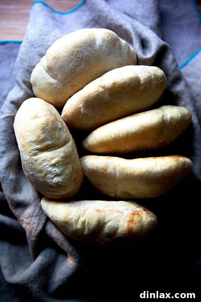 Your Guide to Irresistible Homemade Pita 2 A bowl of freshly baked pita bread, golden and inviting.