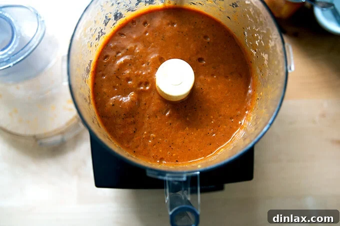 Effortless Homemade Red Enchilada Sauce 9 The freshly puréed enchilada sauce in the food processor, its texture and color now finalized, ready for a taste test and consistency adjustment.