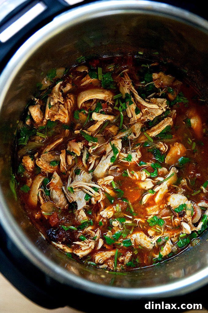Smoky Instant Pot Chicken Tinga 13 An Instant Pot filled with chicken tinga.