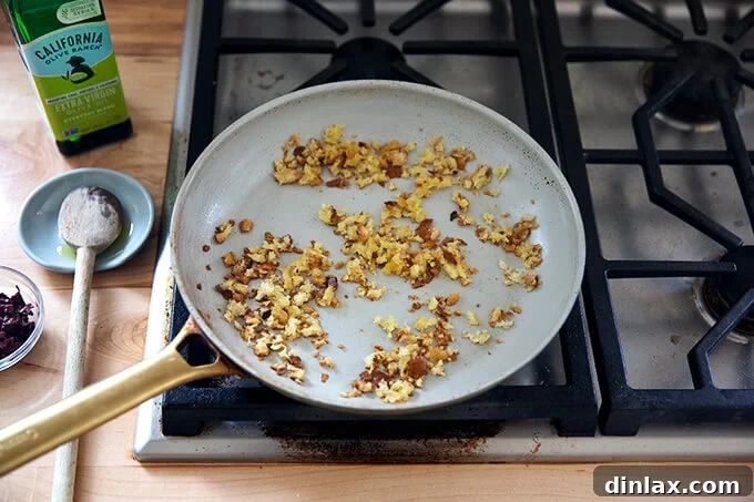 Toasty bread crumbs in a skillet.