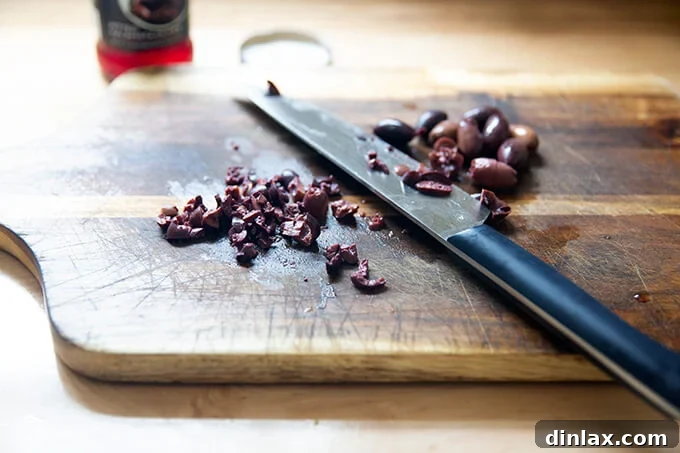 Chopped olives on a board.