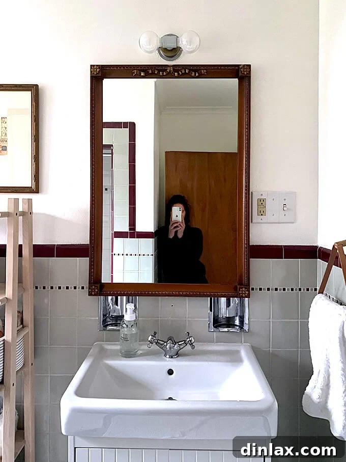 A stylish towel holder by Schoolhouse Electric, complementing modern bathroom decor.