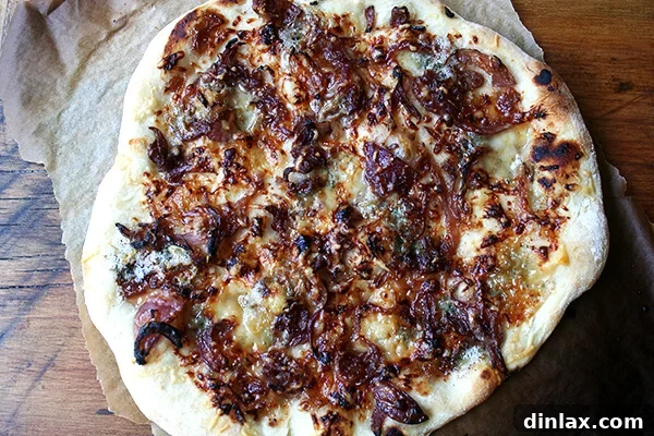 A freshly baked pizza, just removed from the oven, showing its golden crust and melted toppings.