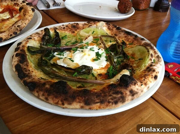Green tomato, ramp, Grana & egg pizza served at 2Amys Pizzeria.