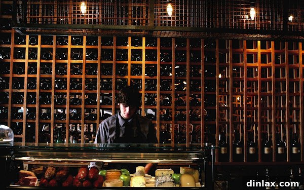 Tinto Gourmet Cheese Board 4 A wide shot of Tinto restaurant's bar, showing patrons enjoying the lively atmosphere and sophisticated decor.