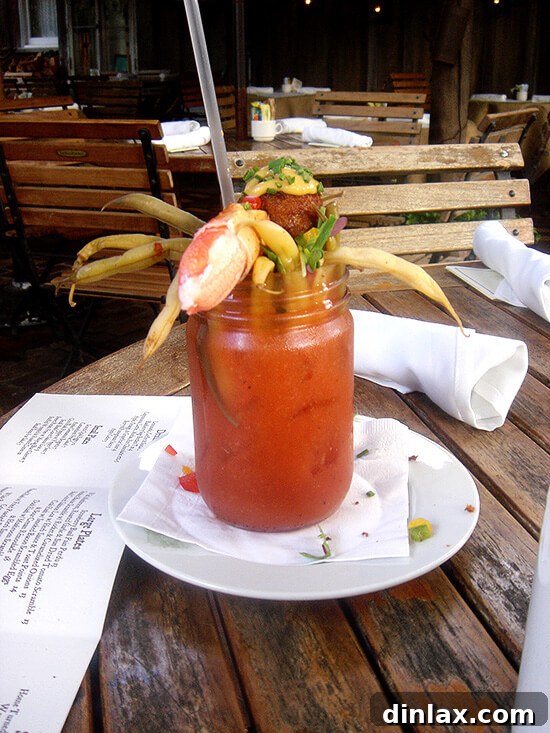The Ramos House Cafe's famous Bloody Mary, garnished with pickled green beans, fresh herbs, and a distinctive Scotch quail egg.
