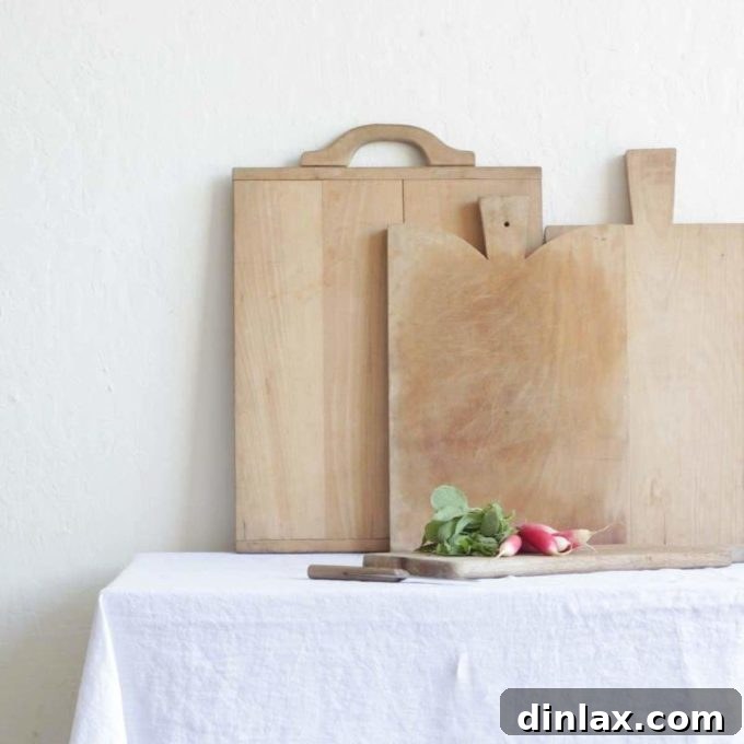 The 2021 Holiday Gift Edit 15 A beautiful vintage wooden cutting board, adding character to a kitchen setting.