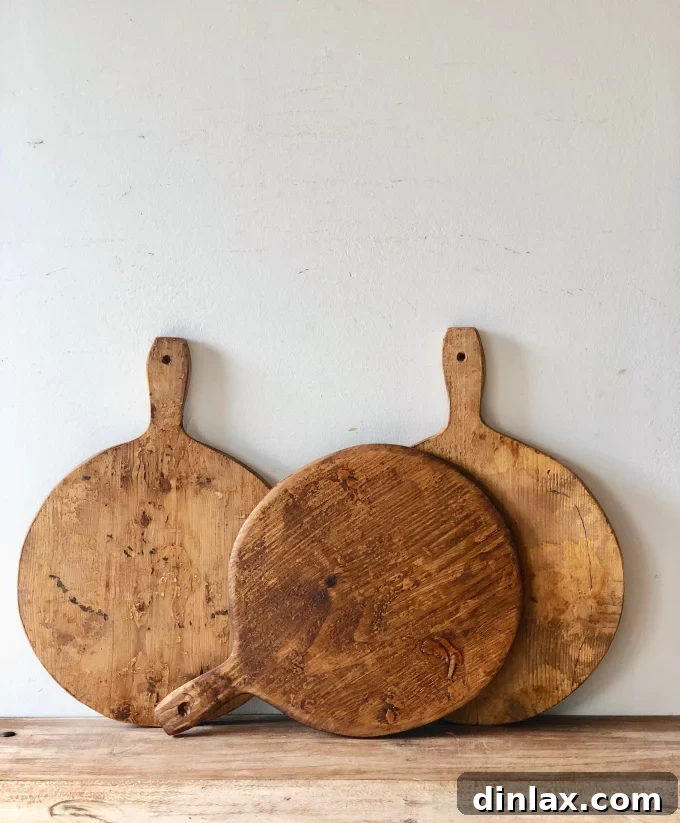 The 2021 Holiday Gift Edit 16 Close-up of a rustic vintage wooden cutting board, highlighting its unique texture and patina.