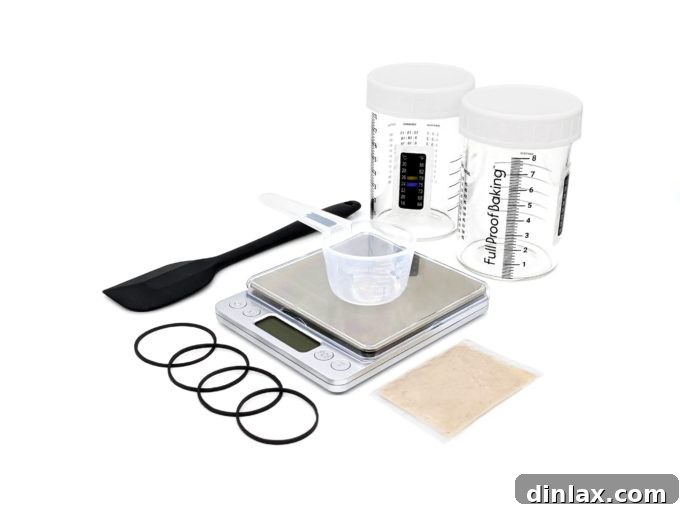 The 2021 Holiday Gift Edit 23 A complete sourdough starter kit with various tools and ingredients on a wooden surface.