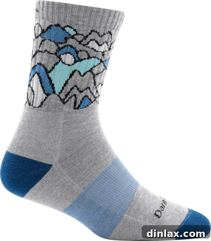 The 2021 Holiday Gift Edit 26 Several pairs of colorful Darn Tough socks, known for their durability and comfort.