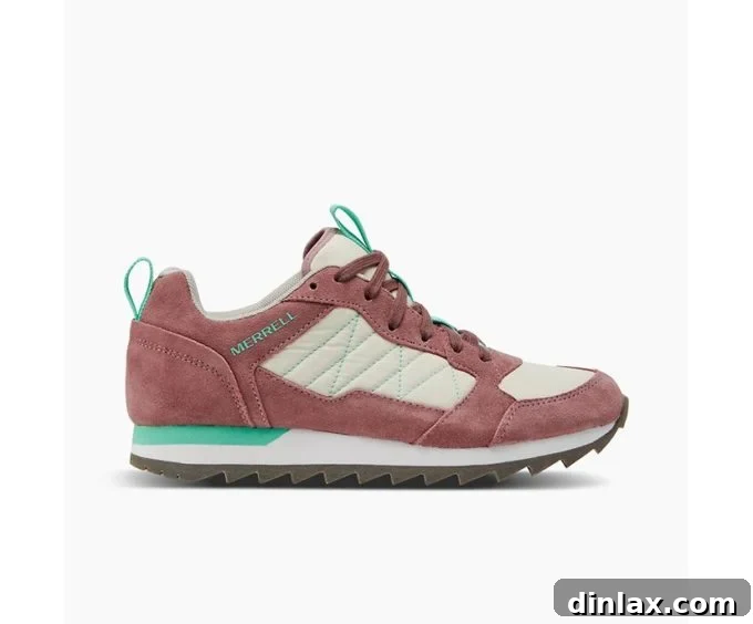 The 2021 Holiday Gift Edit 27 A pair of rugged Merrell hiking shoes, ready for outdoor trails.