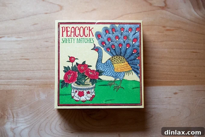 The 2021 Holiday Gift Edit 35 A decorative box of Peacock matches, adding a touch of elegance to any room.