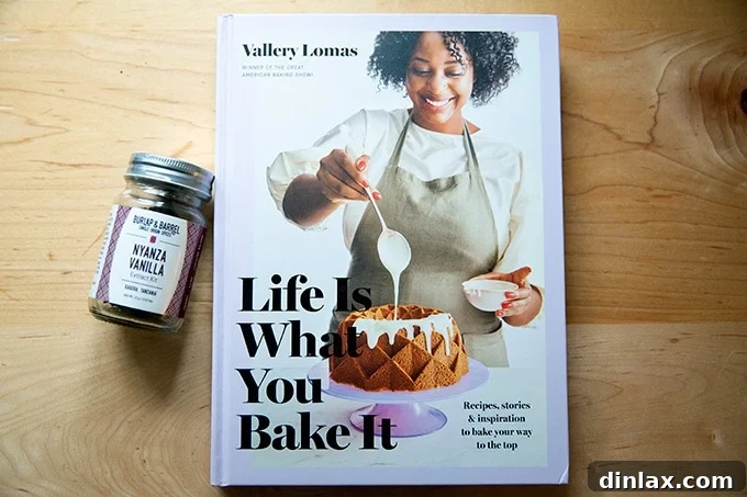 The 2021 Holiday Gift Edit 6 The 'Life is What You Bake It' cookbook by Vallery Lomas, sitting elegantly on a kitchen counter.