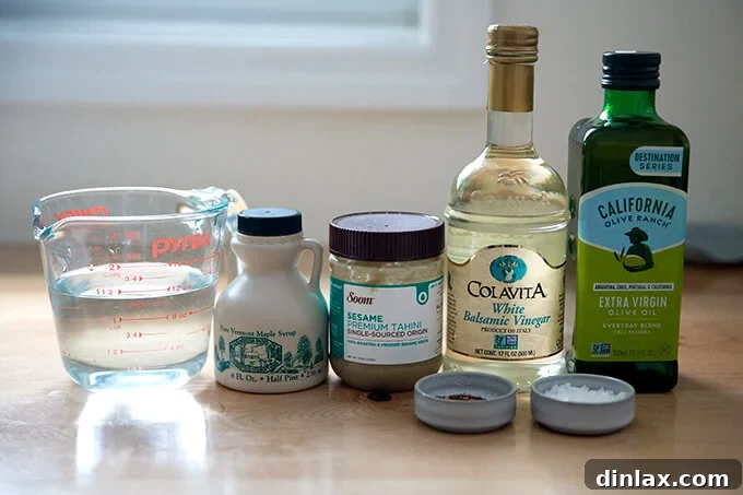 Ingredients to make tahini dressing on a counter top.