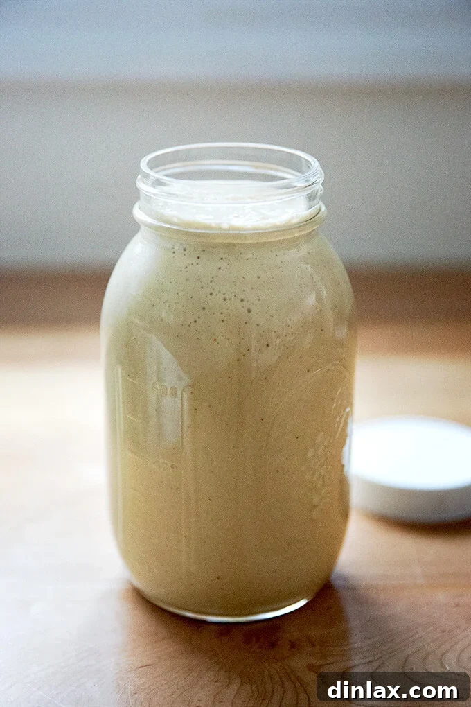 A large jar of tahini salad dressing.